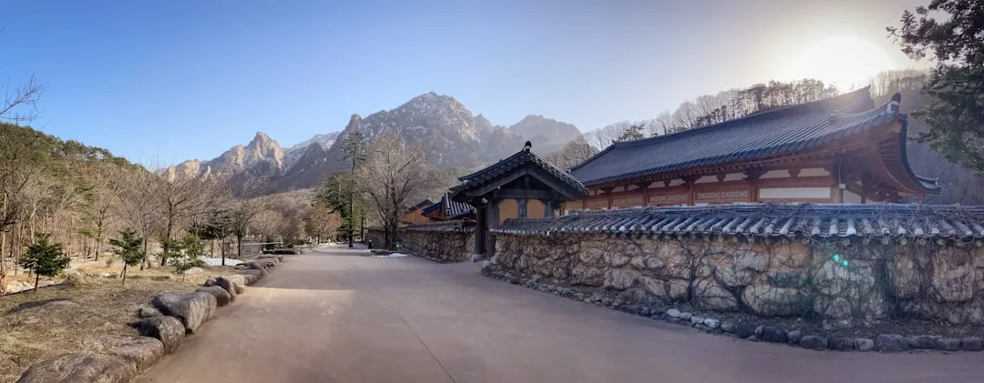 autumn foliage over a mountain temple in South Korea