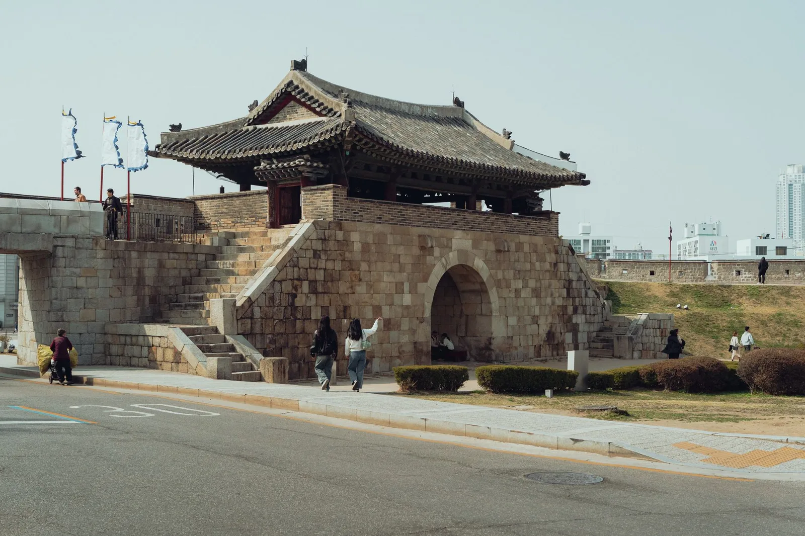Explore the ancient Hwaseong Fortress gate in Suwon, Korea, showcasing traditional architecture.