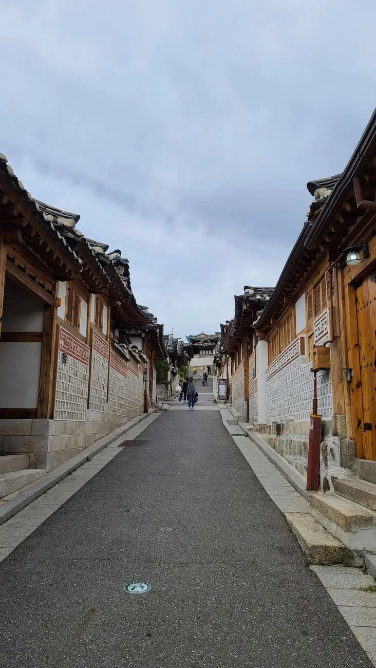 Explore the historic alleyways of Bukchon Hanok Village with traditional Korean architecture.