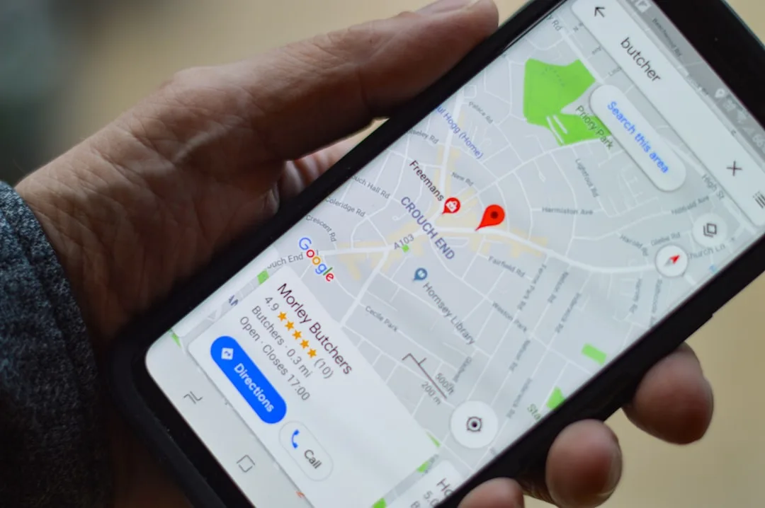 Person using a map app on a smartphone to locate a nearby cosmetics shop