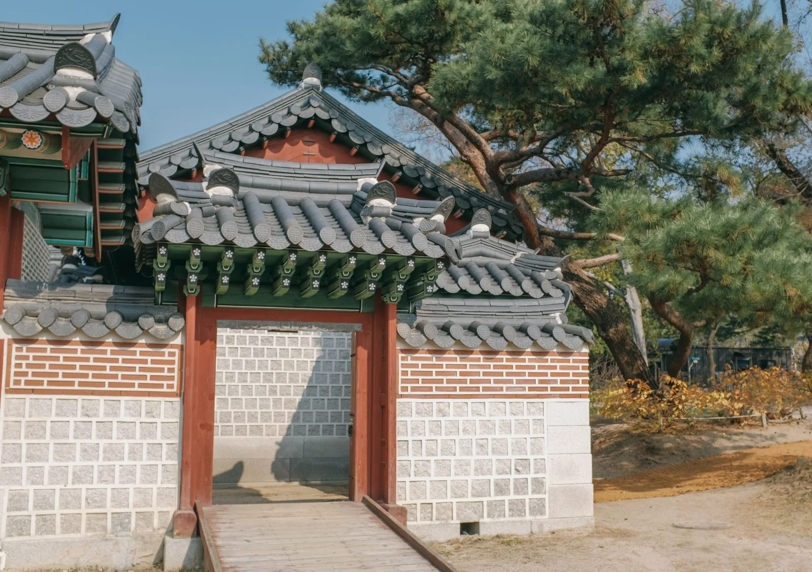 Historic Korean gate in a serene setting at Gyeongbokgung Palace, Seoul.