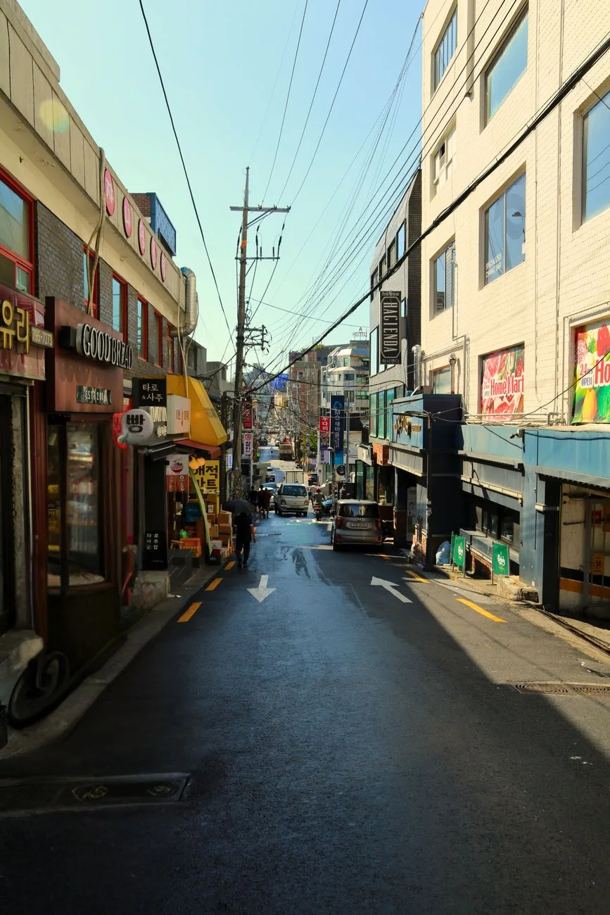 Bustling street in Seoul, South Korea showcasing local shops and urban life.