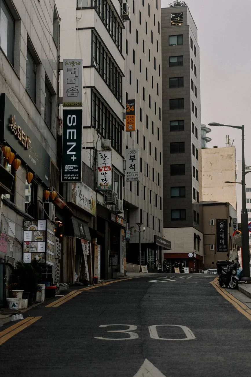 Urban street view in Seoul showcasing city buildings and vibrant storefronts.