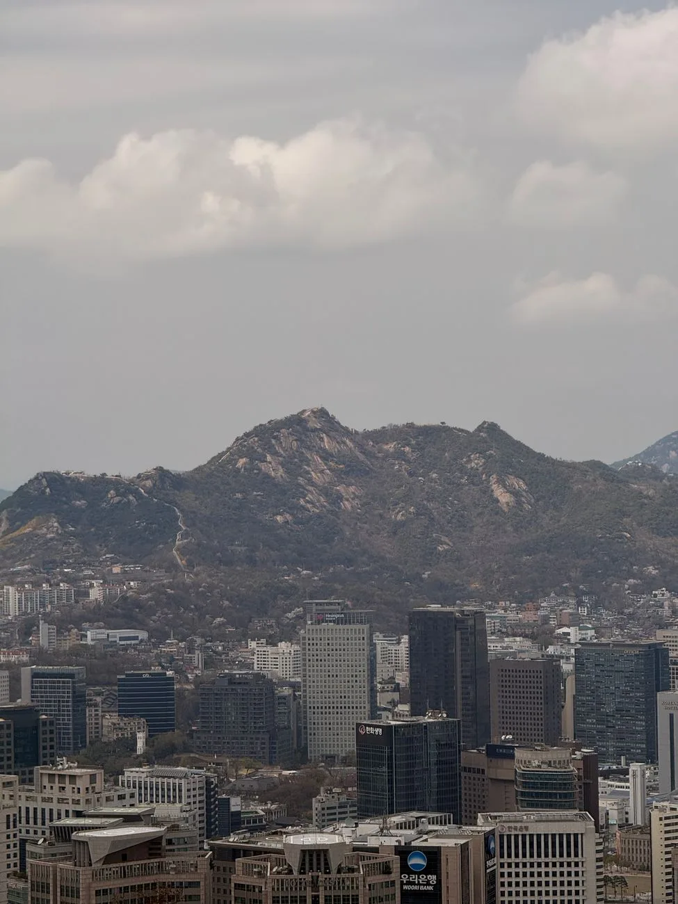 Hikers with smartphones on Bukhansan mountain trail near Seoul